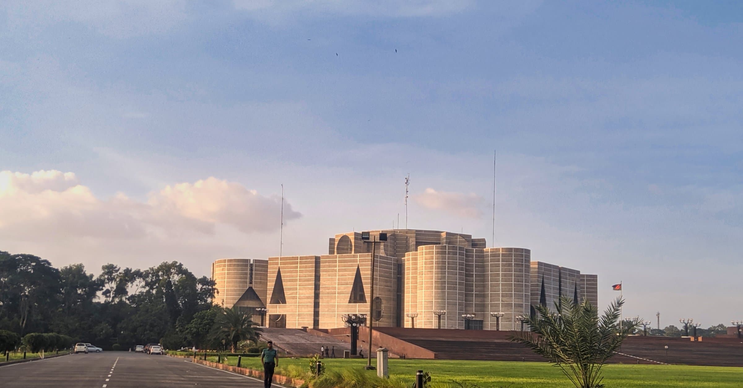 Bangladesh National Parliament House with a digital network overlay tracing the outline of Bangladesh